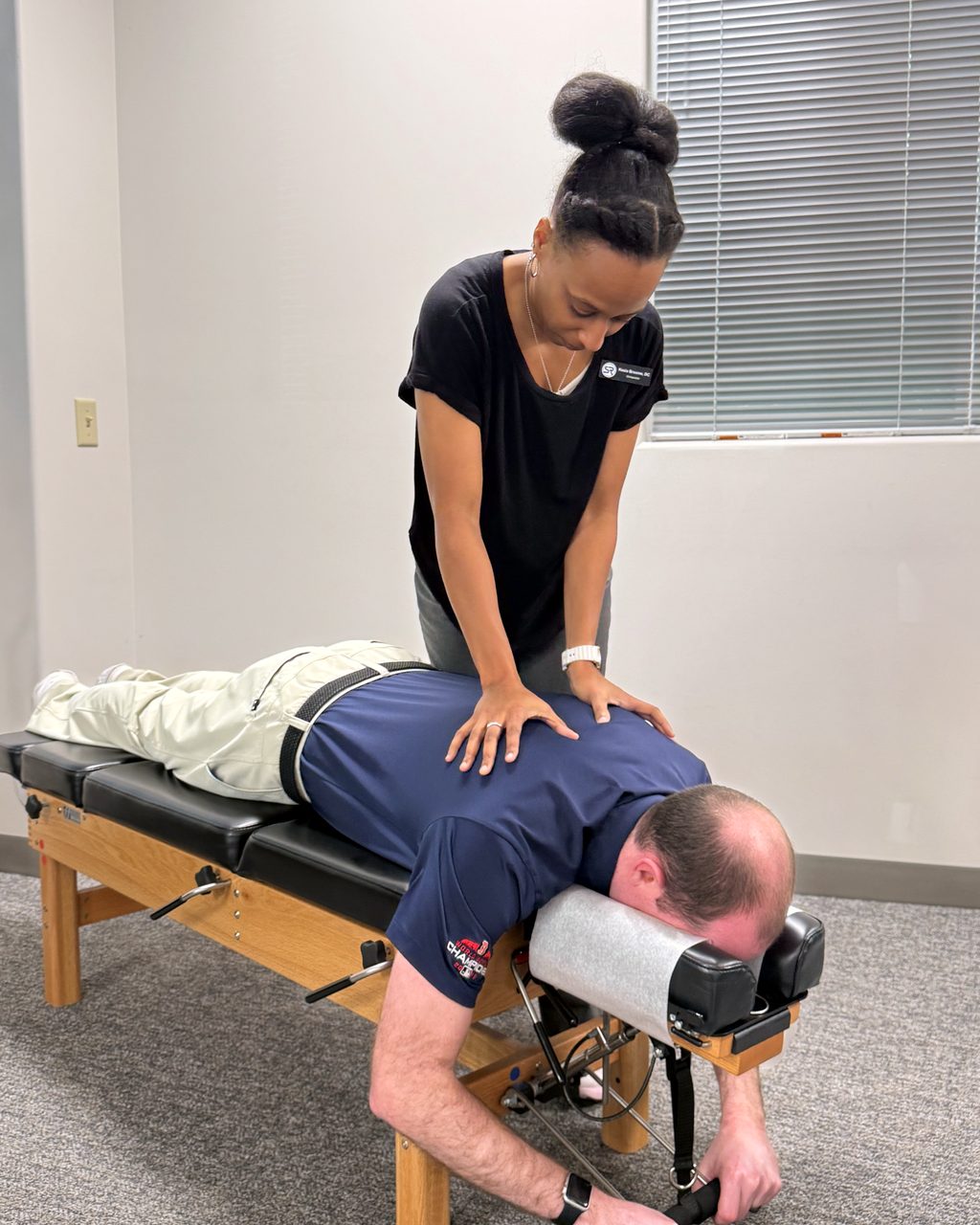 Dr. Kesia Broome delivering a chiropractic adjustment
